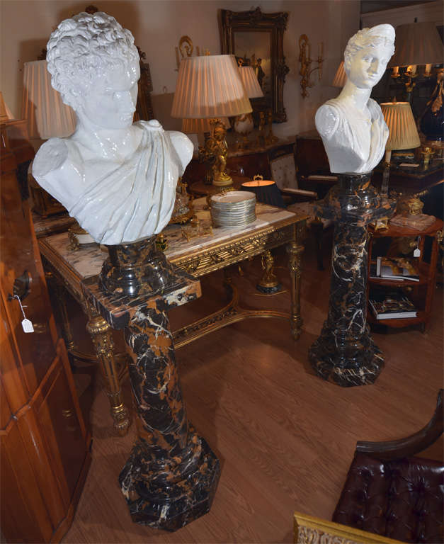 pr of 19th c glazed terracotta Roman heads on marble bases