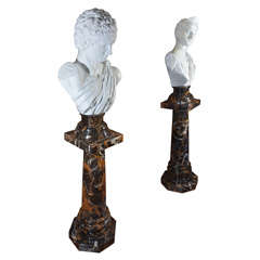 Antique pr of 19th c glazed terracotta Roman heads on marble bases