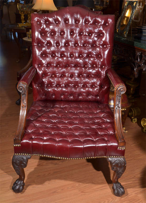 pr of beautiful and large 19th c English gainsborough glazed tufted leather chairs. Beautiful carved chippendale ball and claw feet on the front and back legs