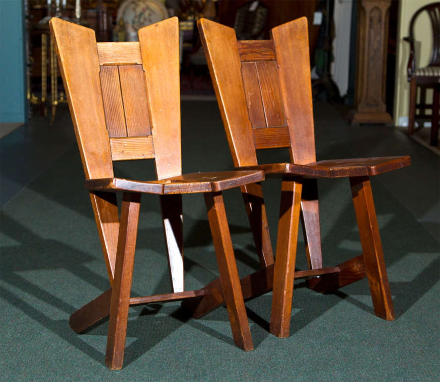 A Pair of Arts & Crafts pitch pine chairs.