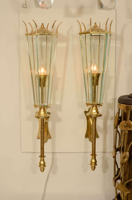 Pair of lantern form brass sconces with glass panes.

View our complete collection at www.johnsalibello.com