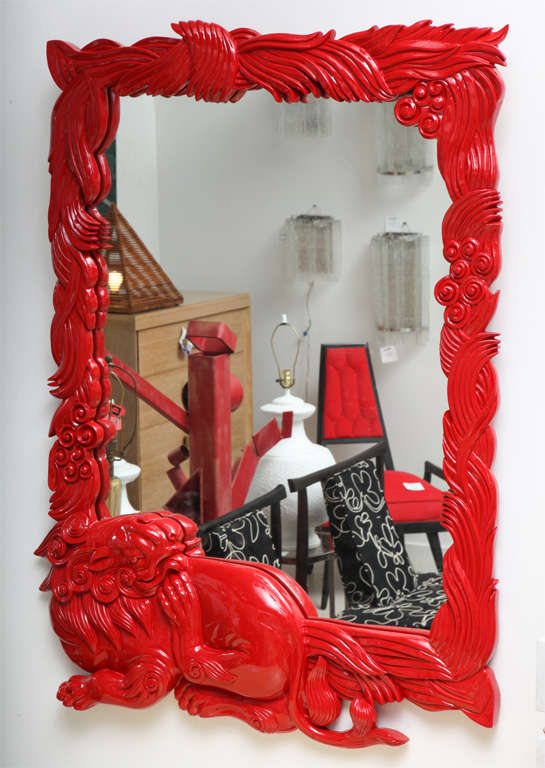 Red lacquer mirror with dragon motif.