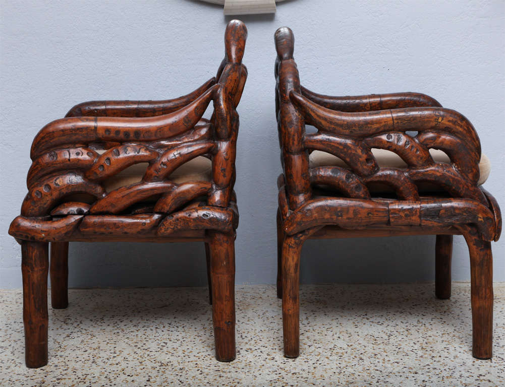 Souvenirs from a 60's honeymoon, we love the organic shape of these eye-stopping chairs. Swamp-salvaged tree roots are joined by wooden pegs to form the back, seat and arms of these bamboo-legged beauties! We'd use them indoors, but imagine they