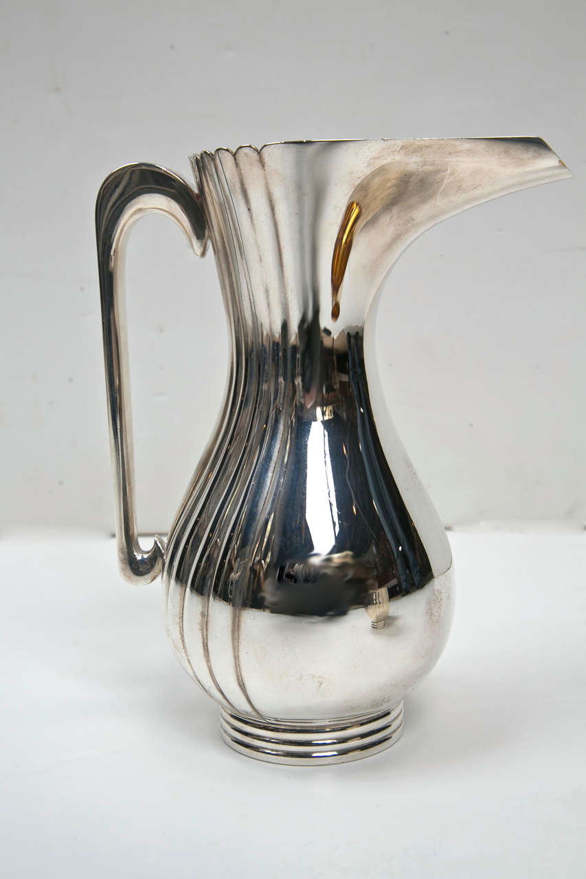 Bvlgari Sterling Silver Water Pitcher and Two Cup Set from London, England By Bvlgari.  Solid weight at 31 troy ounces.  The pitcher weighs 20.5, one cup 5 and the other 5.5.  Marks of the bottom show they were made in London about 20 years ago.