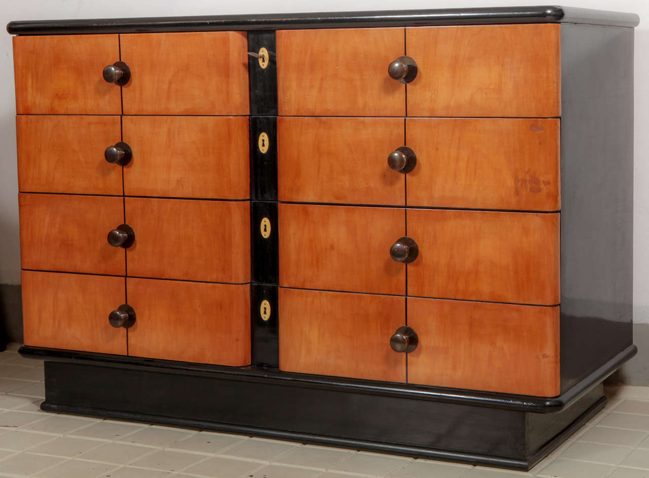 Black laqued  wood and maples wood inlayd with ebony threads chest of drawers. bronze handle  and key and avorioline vents.
Four Drawers.
Made in the 130's By the manufacture Fagioli Firenze.