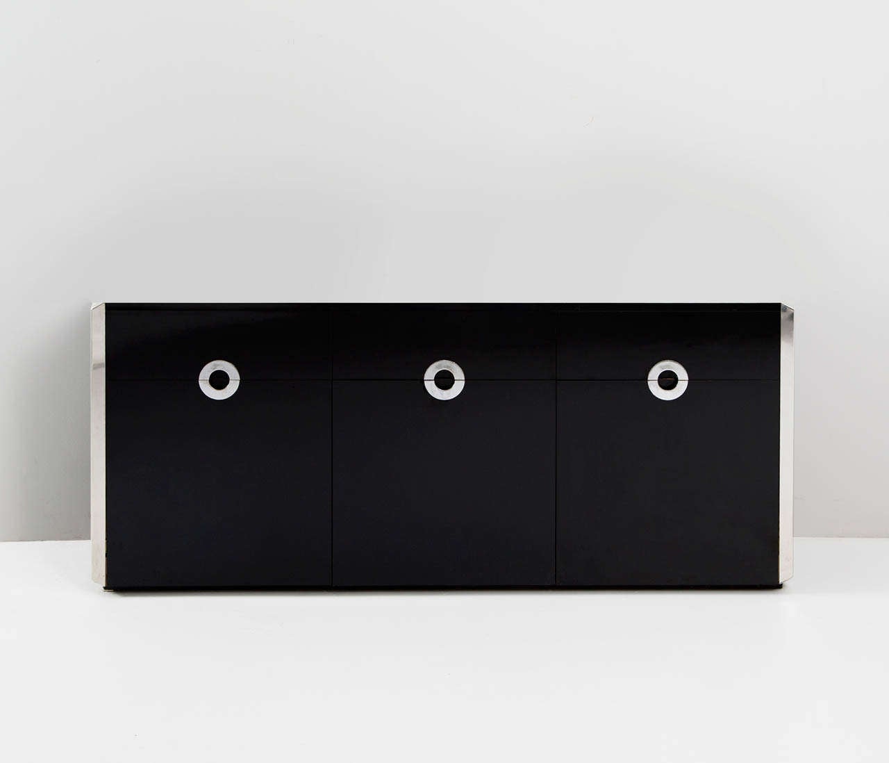 A beautiful sideboard in the style of Willy Rizzo in black laminate and chrome, produced by Mario Sabot in the early 1970s. 

The chromed metal details give this cabinet its wonderful expression. Contains three drawers and three doors with