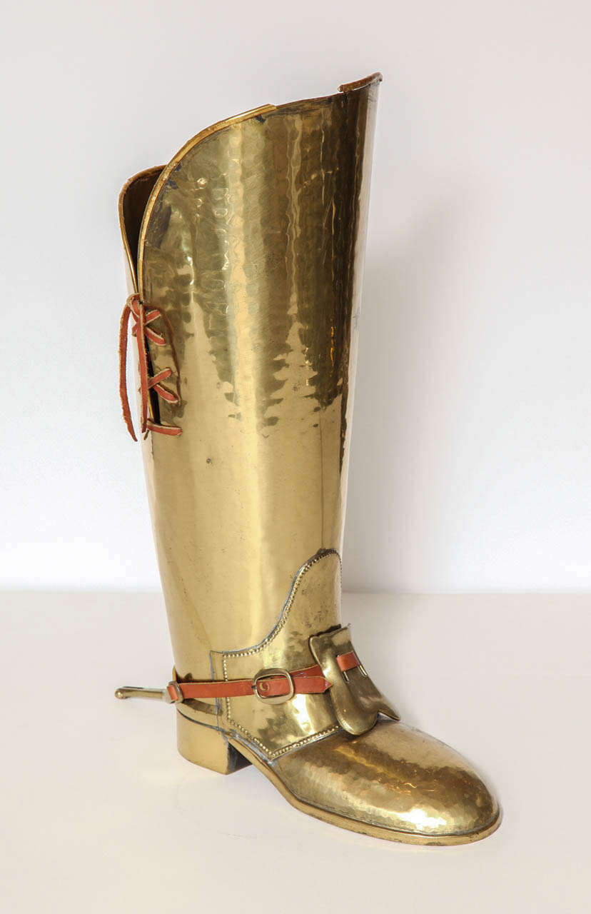 Brass umbrella stand in form of a boot. Italy, C 1950. Great design with leather details.