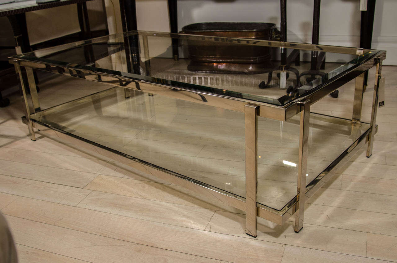 Two-tiered nickel plated brass and glass coffee table, both shelves with beveled glass