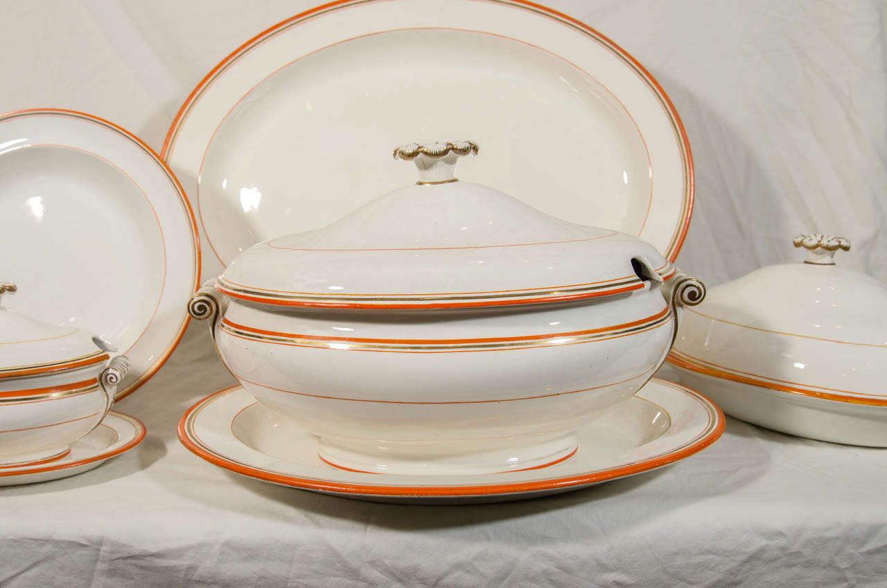Neoclassical Wedgwood Group of Platters, Dishes and Tureens with Orange and Gilt Borders