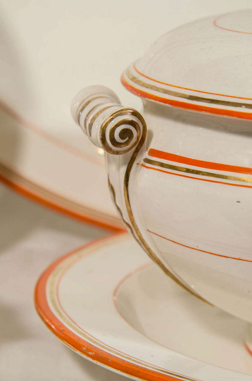 Wedgwood Group of Platters, Dishes and Tureens with Orange and Gilt Borders