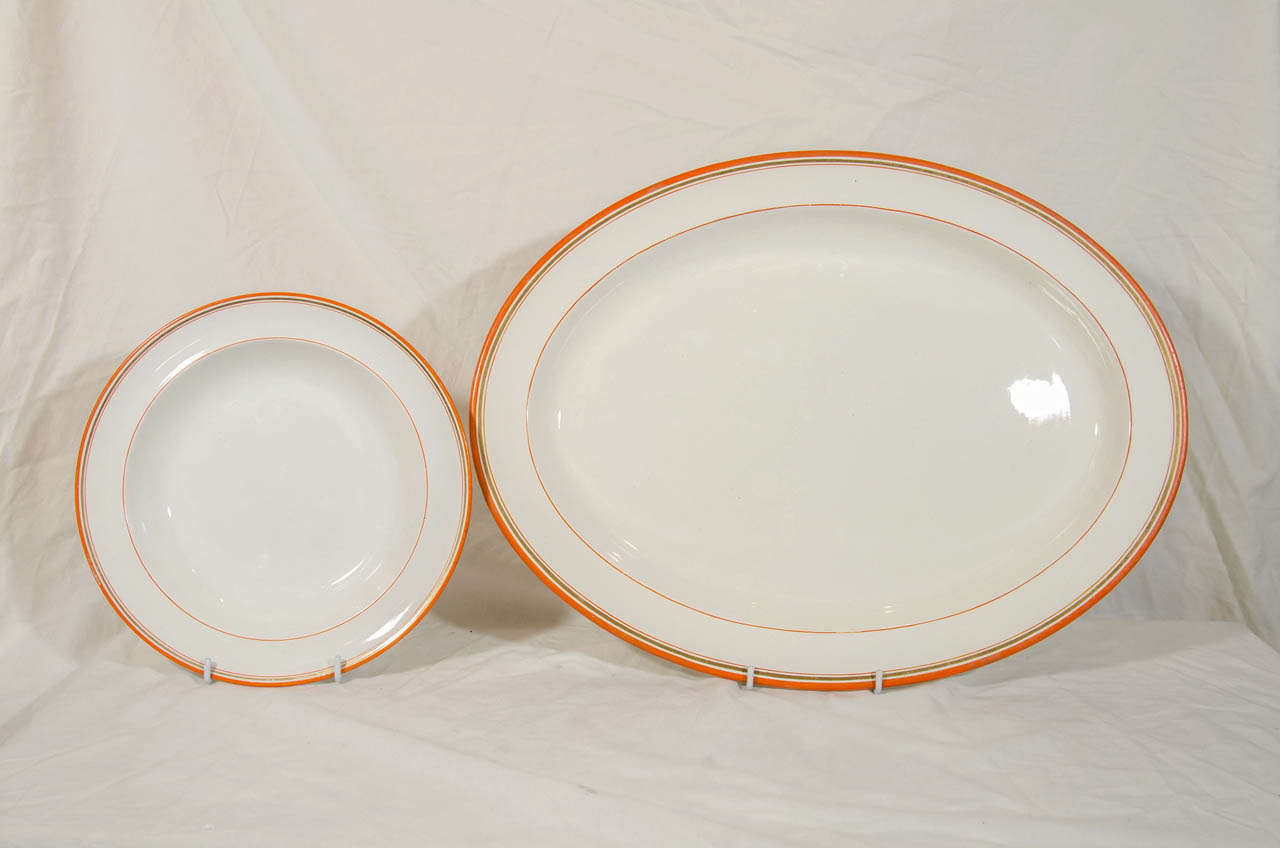 Creamware Wedgwood Group of Platters, Dishes and Tureens with Orange and Gilt Borders