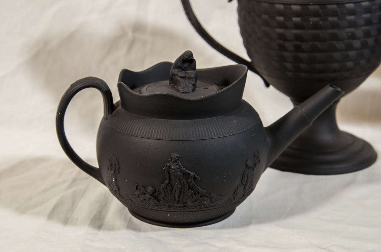 English A Collection of Black Basalt Tea and Coffee Pots