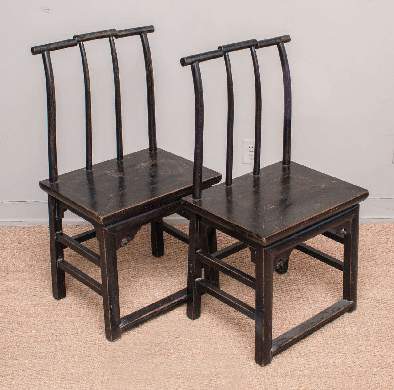 Chinese lacquered elmwood, sprindle back side chairs.