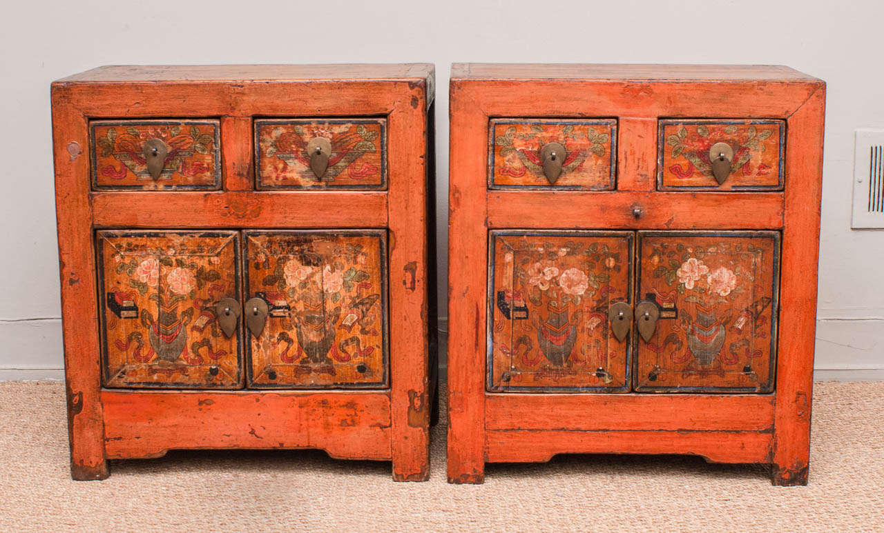 Charming pair of small chests with original hand painted floral motif with orange painted surround.