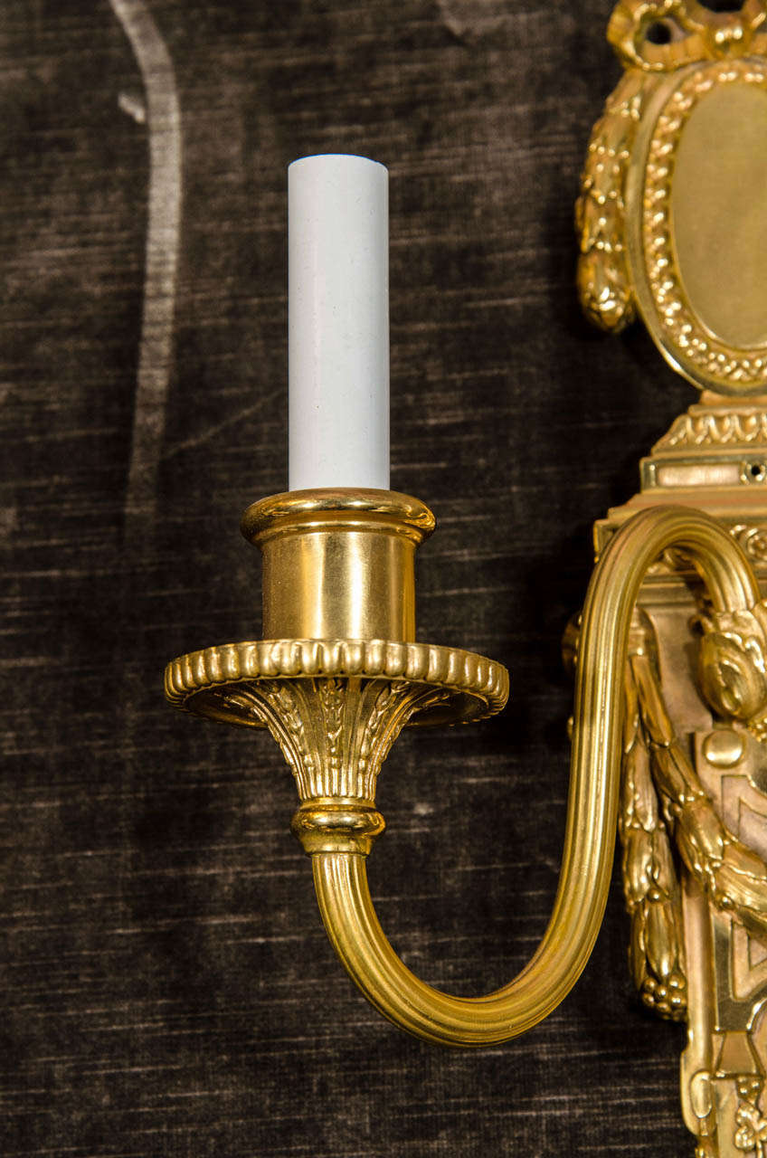 20th Century A Pair of  American Louis XVI Style Gilt Bronze Wall Sconces by E. F. Caldwell For Sale