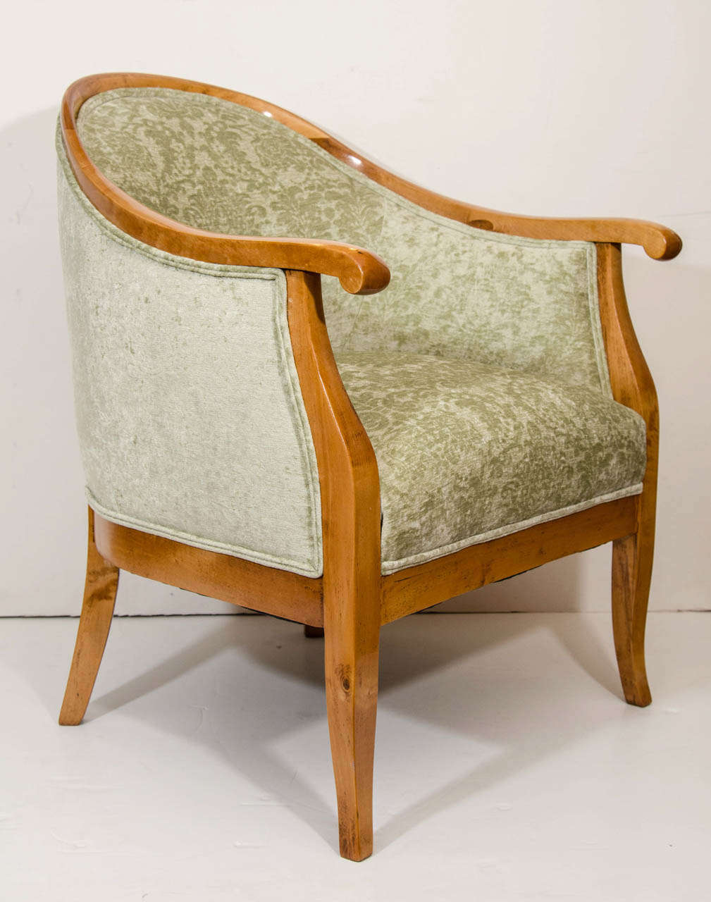Carved from solid birch and stained a light caramel tone, the deep sprung seats and upholstered, curved backs provide tailored as well as tasteful comfort.