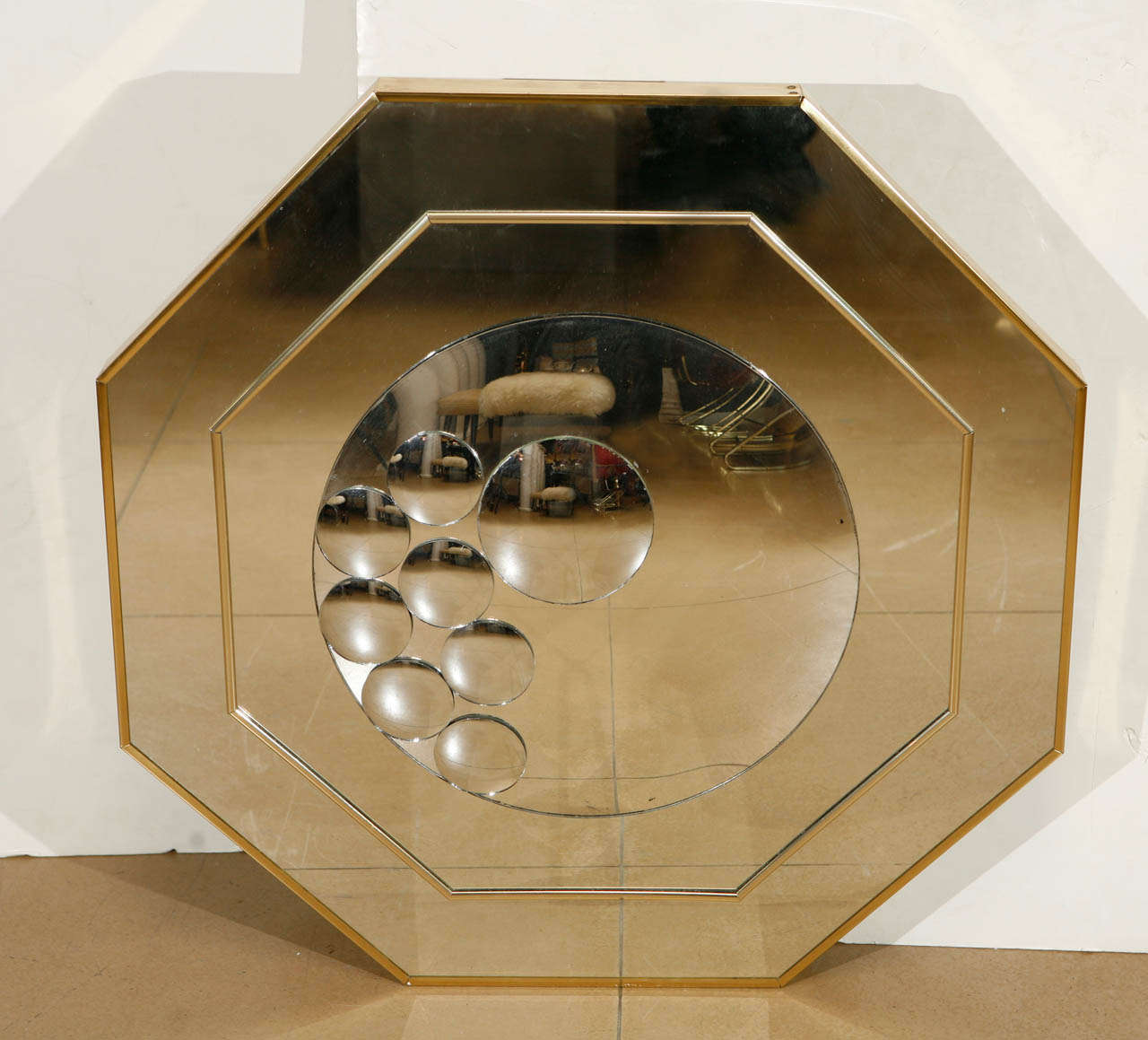 1970's Octagon shaped mirror with circular convex mirrored shapes affixed to top.