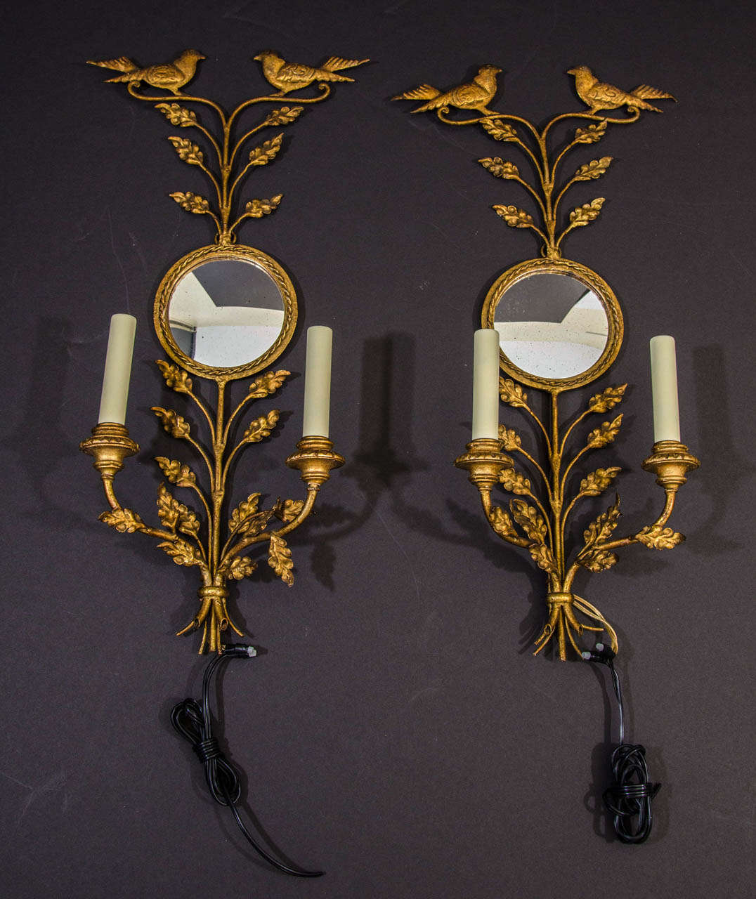 Pair of Gilt Iron Two Light Convex Mirrored Back Sconces With Oak Leaves And Birds.