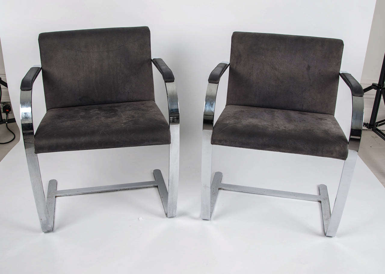 Three sets of two chairs designed by Ludwig Mies van der Rohe in 1930 and made by renowned Italian maker Fasem, are covered in the original mid-grey fine Italian suede. The chrome steel is heavy gauge and of excellent quality and design.  
Can be