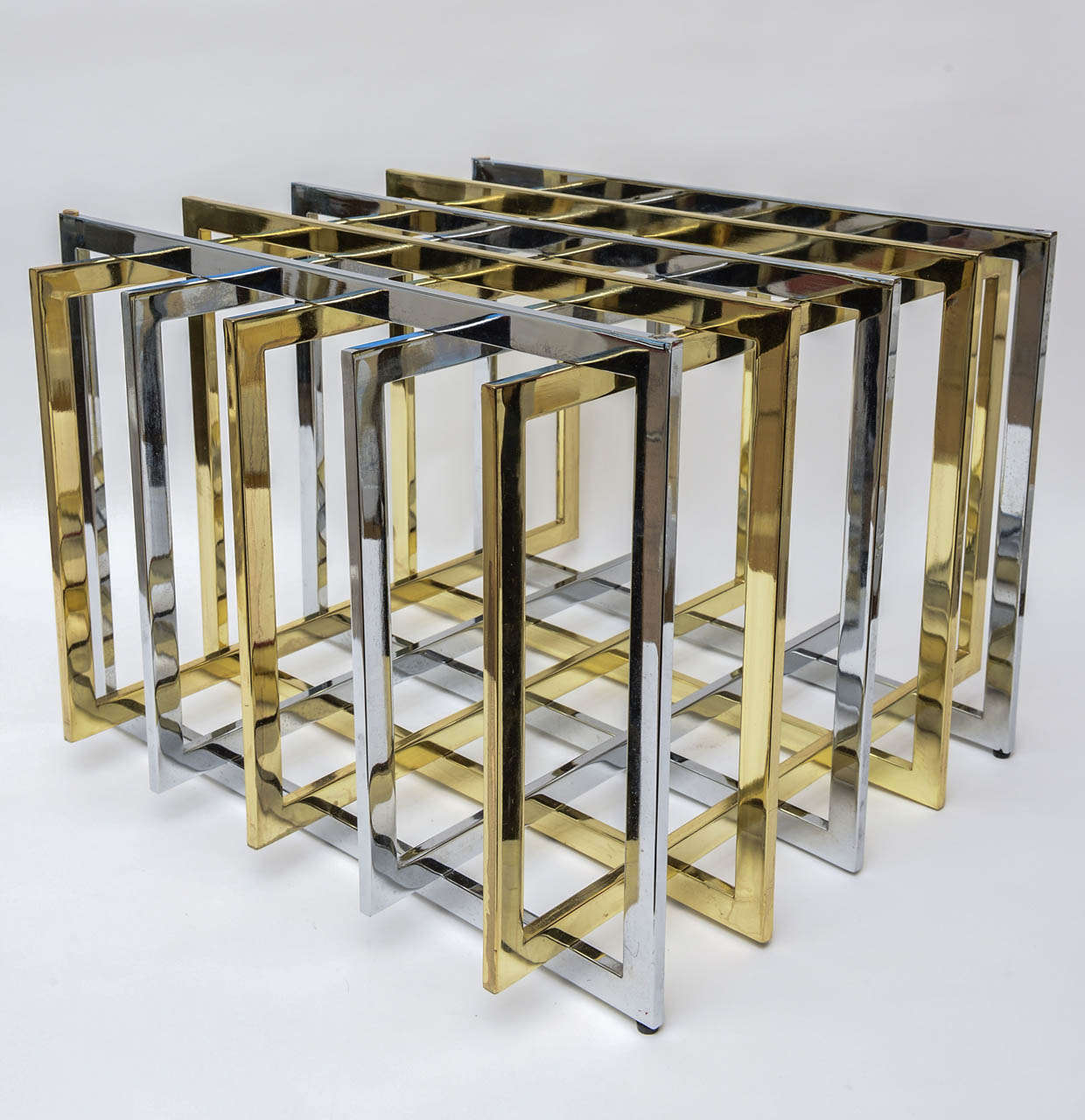 Brass and Chrome meet in a grid /puzzle table base... by Pierre Cardin. Sculptural and wonderful!! The two mixed metals add dimension. This is a classic!!!
We do not have glass for this one.

Please note: we have another one to make a great