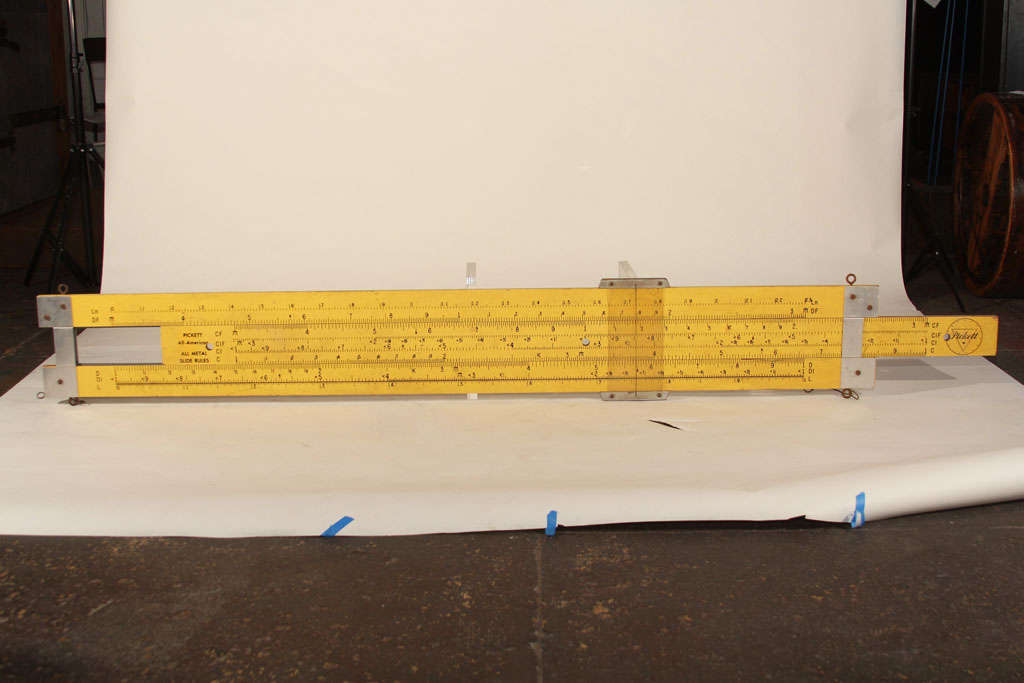 Originally used as a teaching aid, this 7 foot slide rule would look amazing displayed as a work of art  in a loft, lobby or retail environment. It is fully functional and in excellent condition.  This is a show stopper!