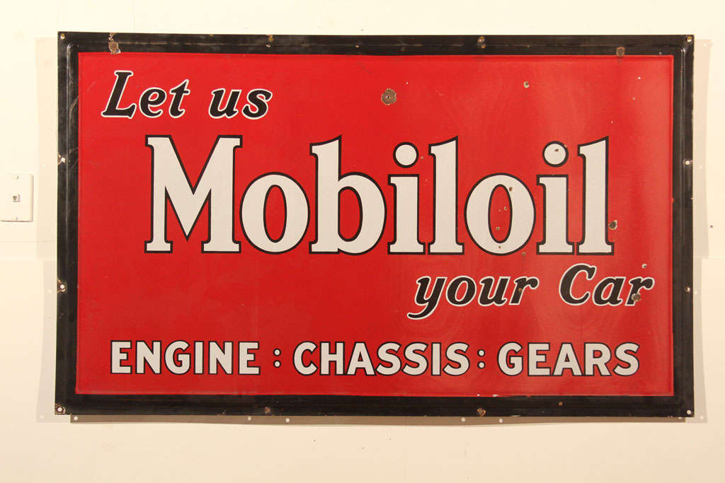 This porcelain Mobiloil sign circa 1940's comes fully equipped with bullet holes and great patina! A stunning addition to any boutique,garage or restaurant.
