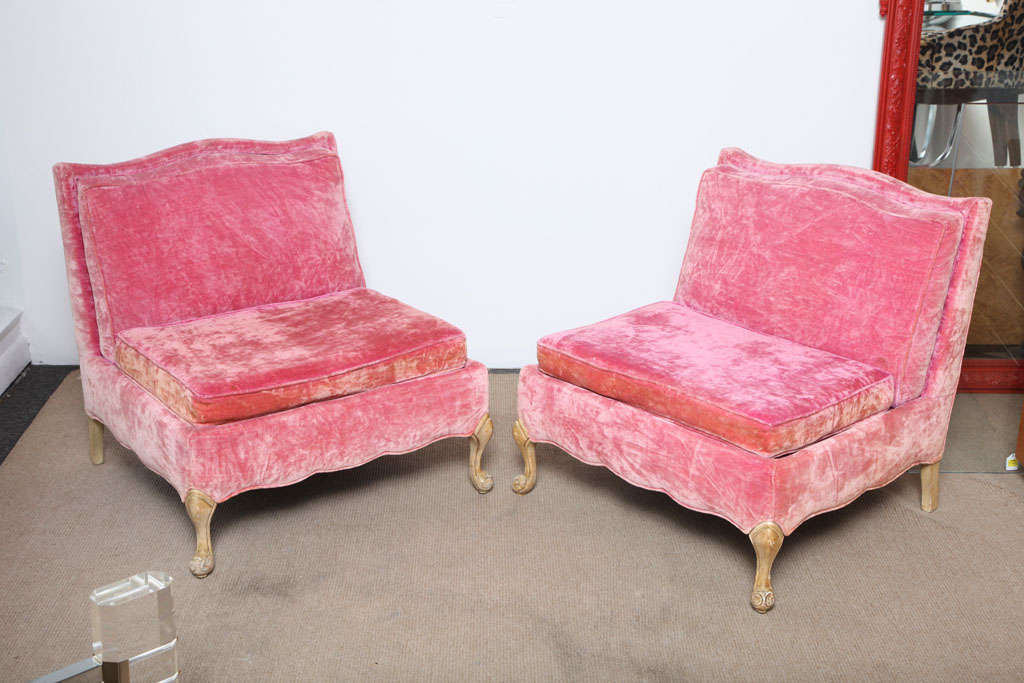 Phenomenal 1940's large-scale slipper, ultra low, wide seats. Just beautiful and comfortable pair of mid-Century Chairs styling with vibrant pink velvet fabric. Even if the pink is a bit worn  with age, it gives something very special to these two