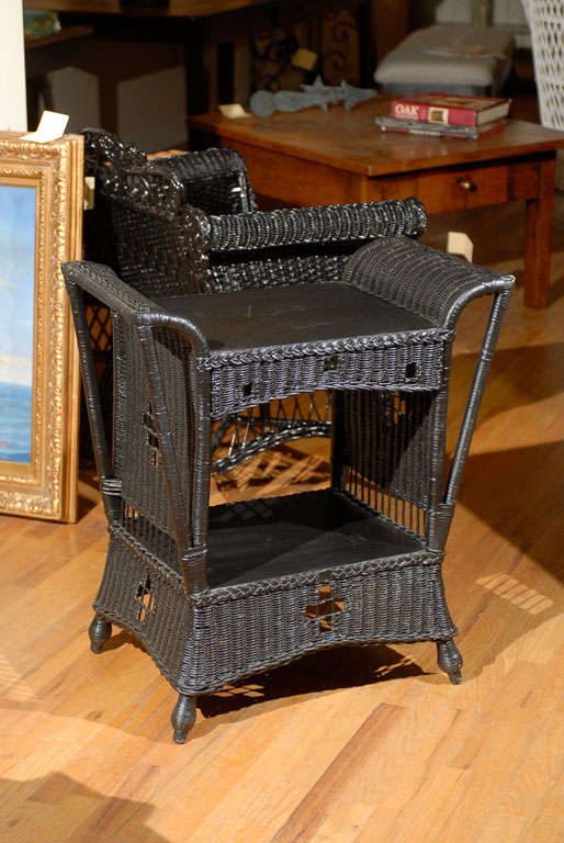 This is a very handsome wicker table in the Stickley style.  The Stickley Brothers company was started in late 19th century.  Their style of simple yet honest furniture was meant to be used.  Stickley designed many different types of furniture