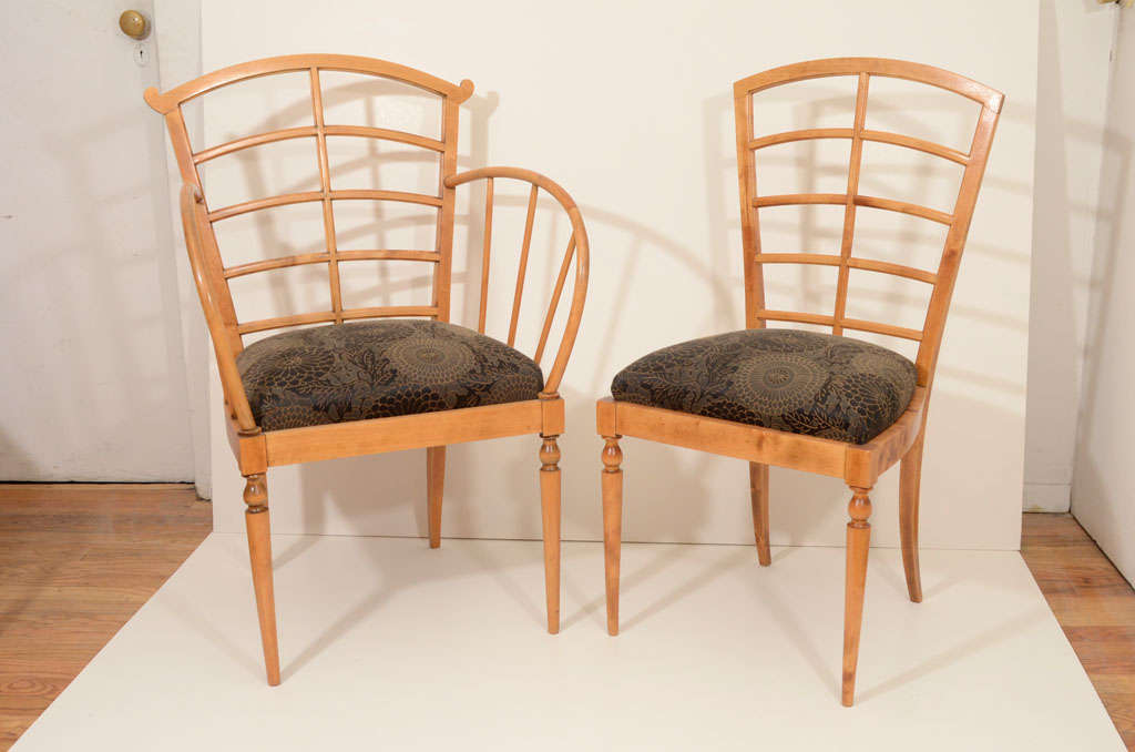 A versatile set, comprised of a pair of armchairs, four side chairs and a pair of benches. The seating elements can be used throughout the home and assembled for the dining room, as entertaining size dictates.