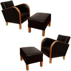 A Pair of Art Deco Club Chairs with matching Ottomen