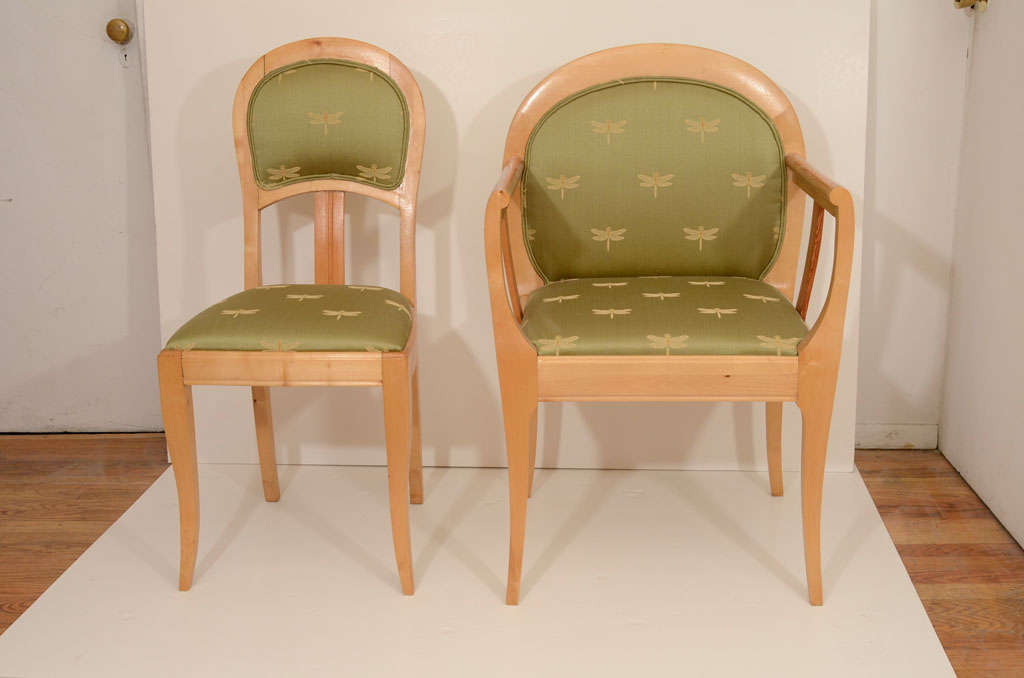 This Swedish interpretation of Art Nouveau, features a pair of comfortable head chairs with arms, and four side chairs. As was customary, the side chairs reflect the same design details as the head chairs, but are more petite. Featuring upholstered