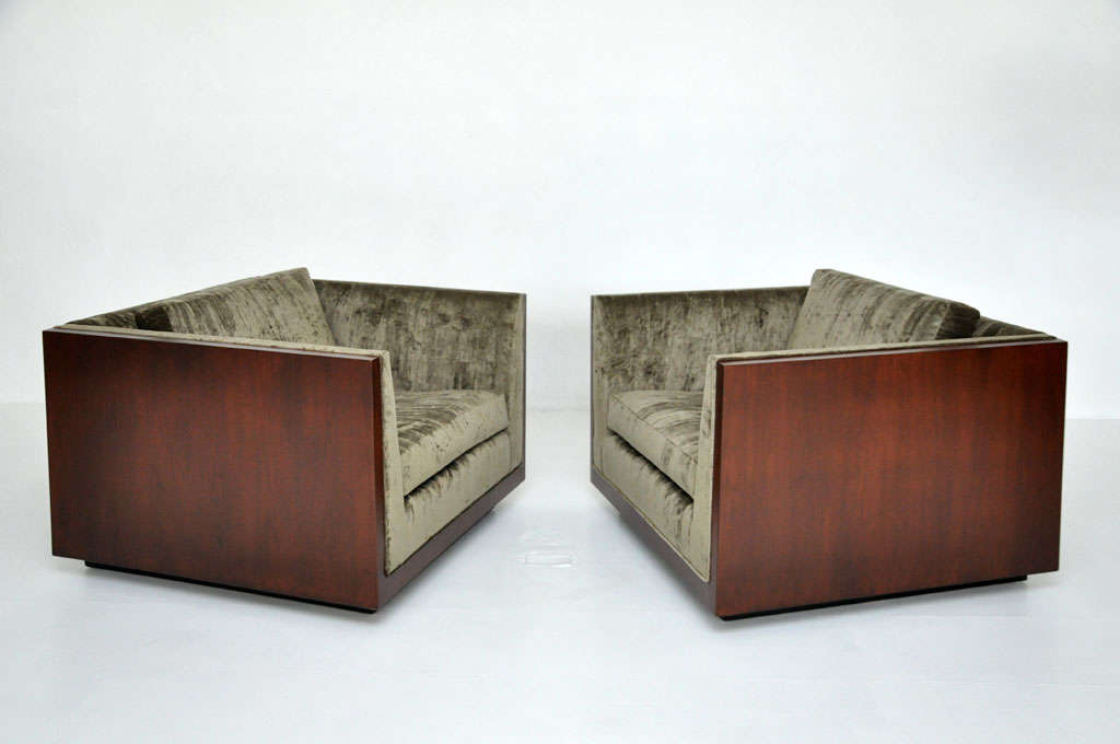 Pair of cube lounge chairs designed by Milo Baughman for Thayer-Coggin.  Walnut cased sides with velvet upholstery.