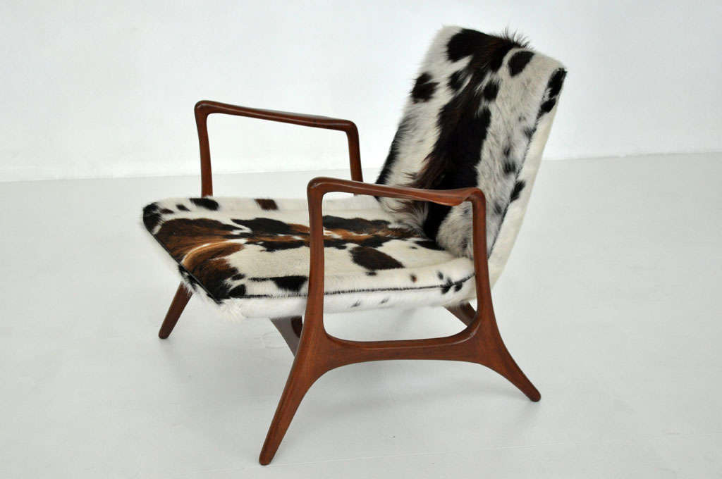 Rare lounge chair by Vladimir Kagan for Kagen-Dreyfuss.  Sculptural walnut frame with pony hide upholstery.
