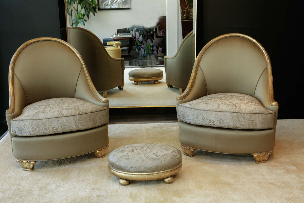 Gorgeous Salon Chairs and matching foot stool upholstered in golden olive silk with embroidered seat cushions. Frame and feet in 22K gold leaf.