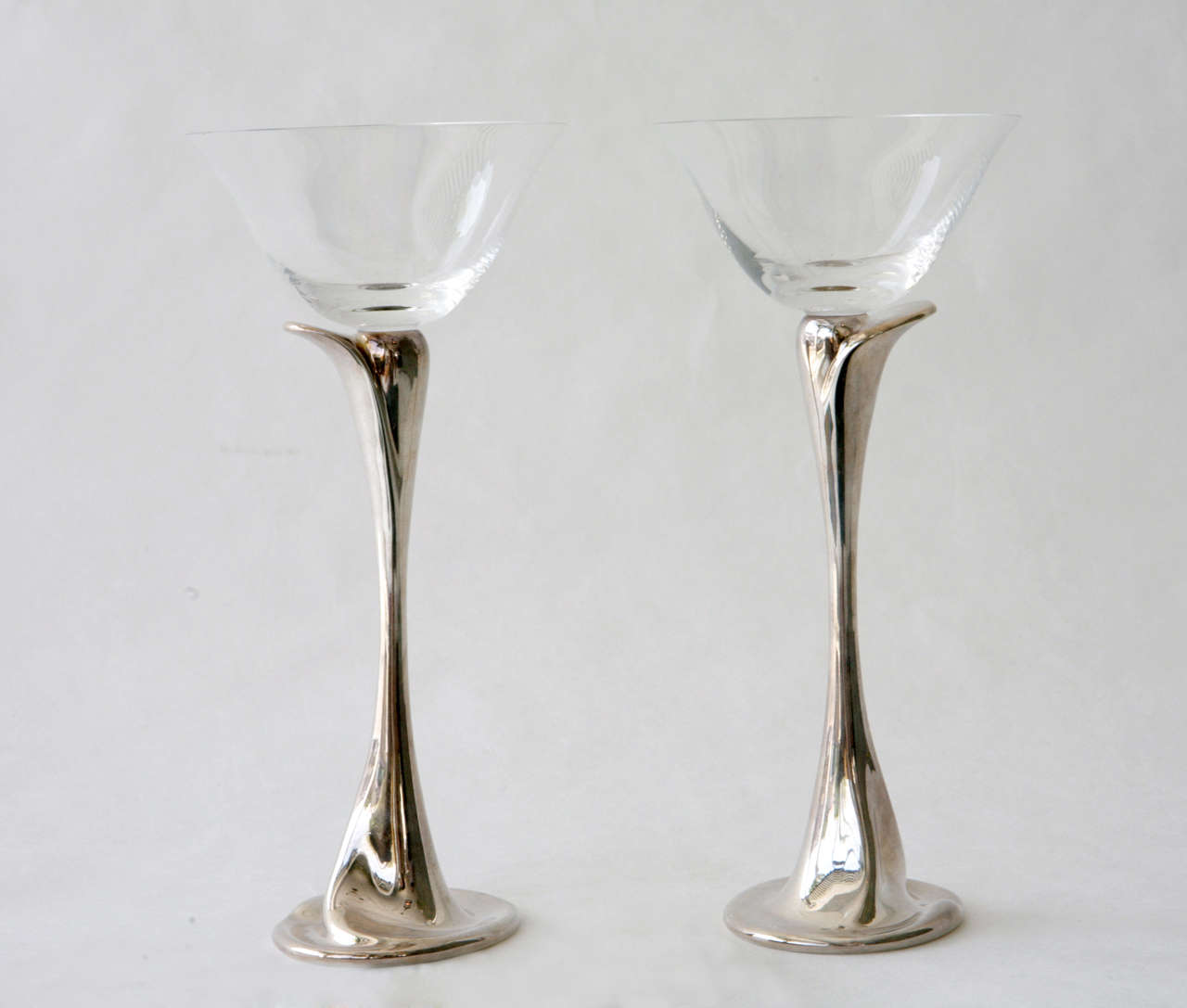 A lovely set of eight crystal and sterling goblets by Elsa Peretti for Tiffany & Co. Stamped on the bottom 