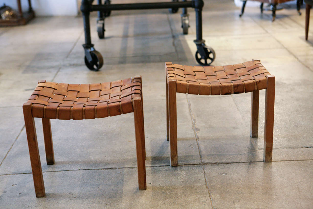 an anonymously designed pair of leather strapped danish stools. *sold only as a pair