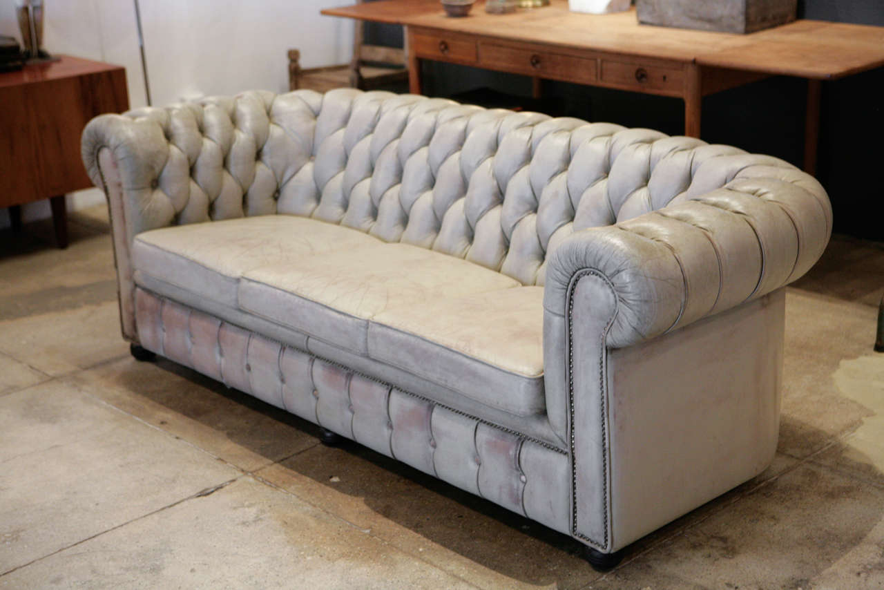 a beautifully unique off-white leather chesterfield from france.