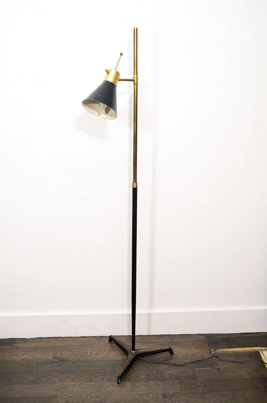 Mid Century black and gold task floor lamp with tri-base. Pivoting diffuser offers flexible options for direction of light. Refurbished and fully rewired for the US market.