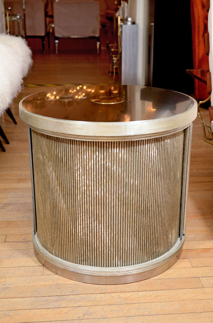 Pair of drum form side tables with sliding door compartment and faux finishing details.

View our complete collection at www.johnsalibello.com
