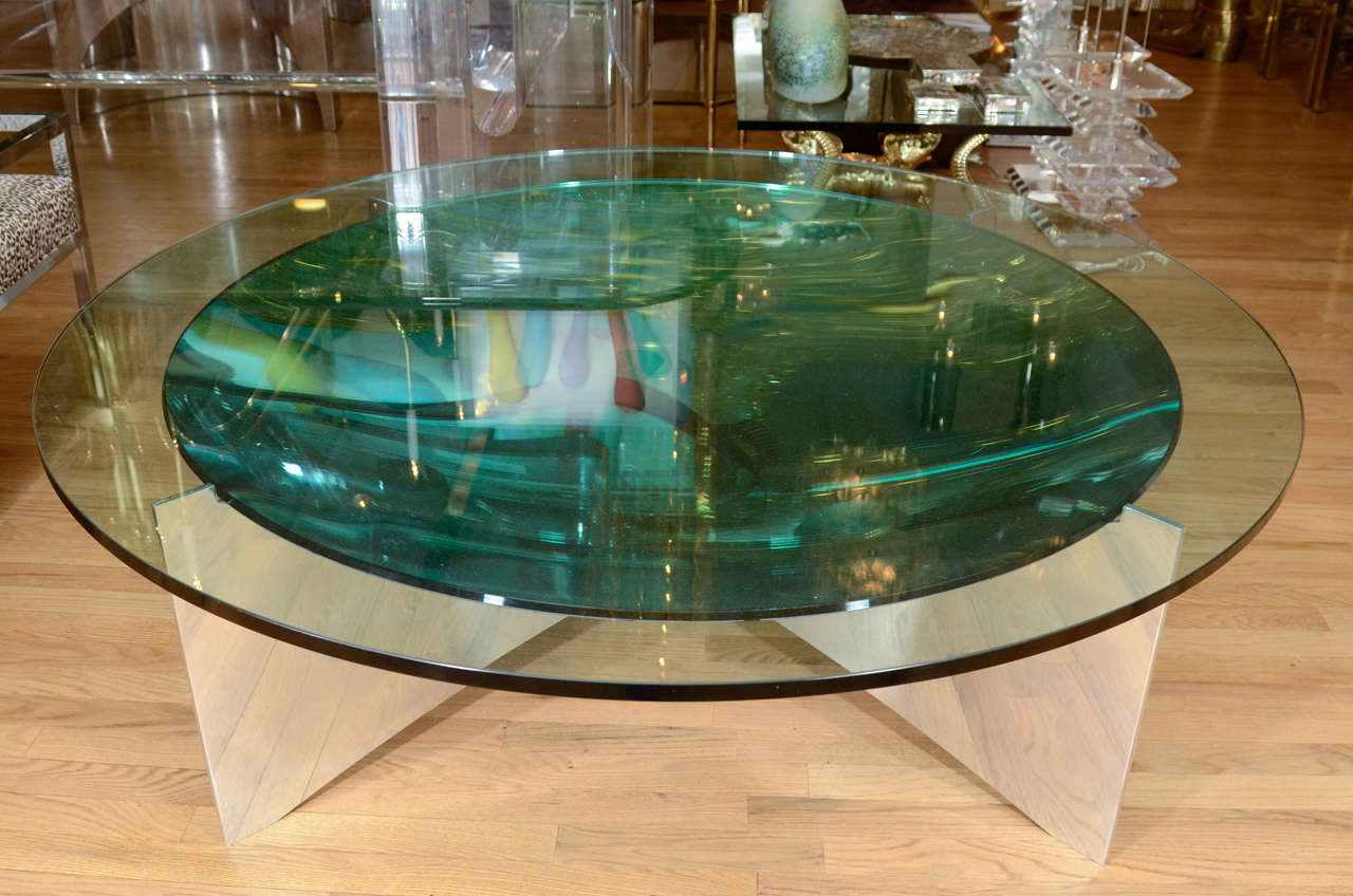 Unusual concave green glass coffee table with glass top and aluminum X base.

View our complete collection at www.johnsalibello.com