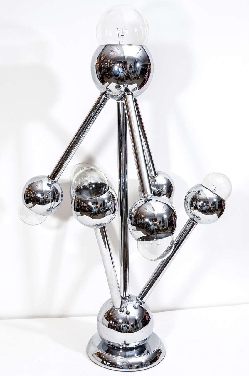 Exceptional pair of chrome sputnik/atomic lamps featuring a 3 way switch which allows for a great lighting variety. Designed by Robert Sonneman.
