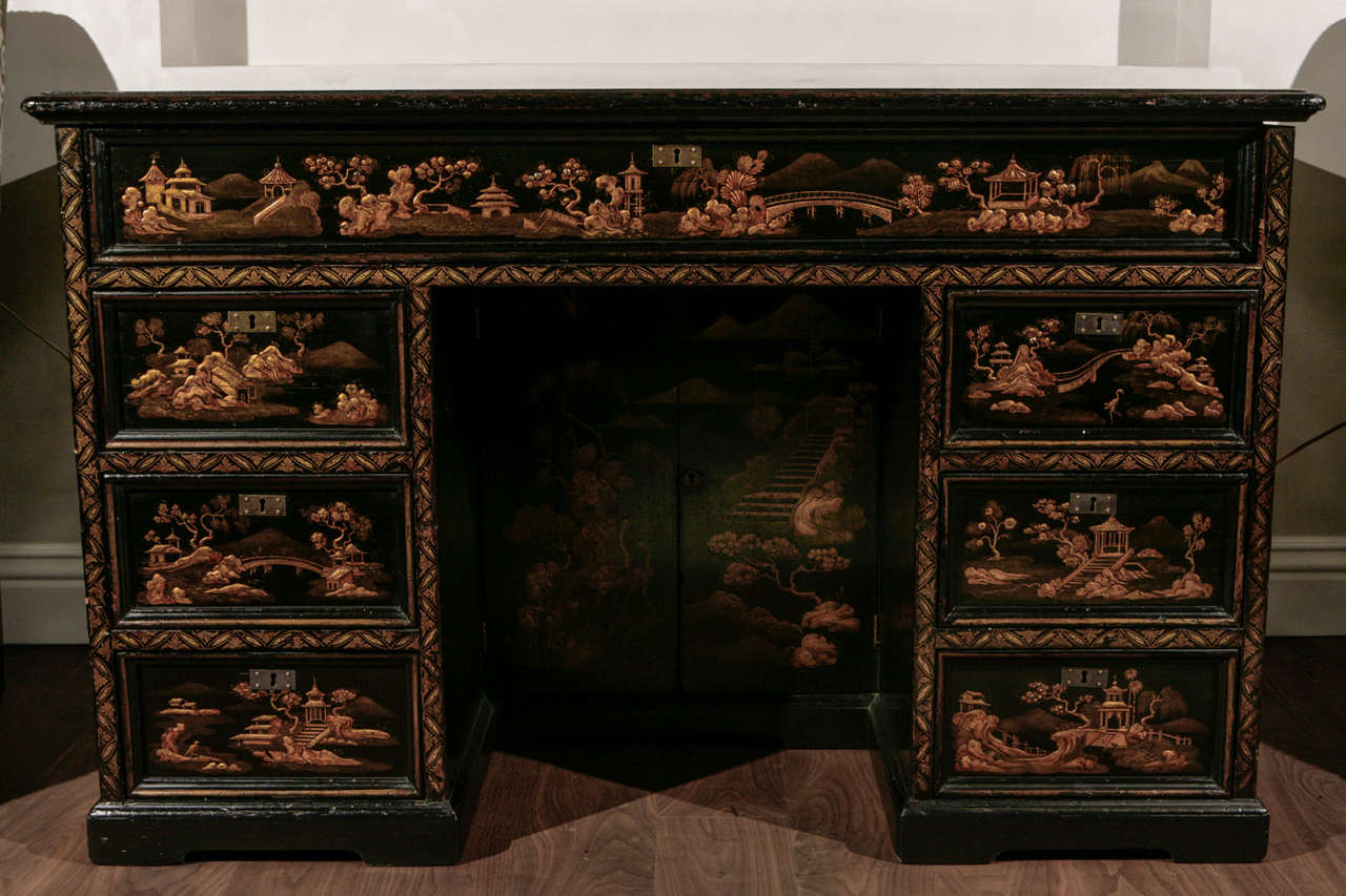 19th century English Chinoiserie Knee Hole Desk with Raised Chinoiserie Decoration.  The Key is included.