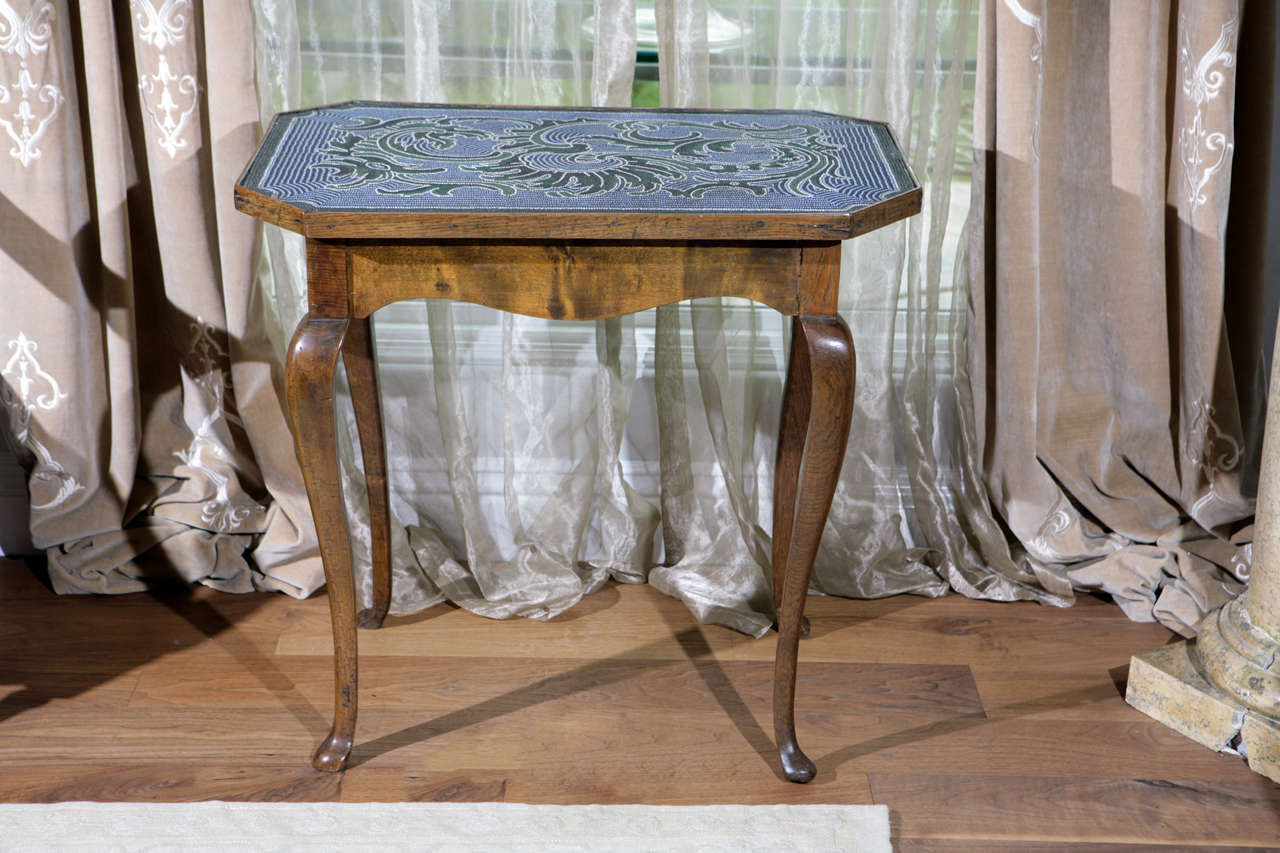 18th century Austrian Occasional Table with Hand Beaded Rectangular Top with Cut Corners.  The Beading is in Emerald Green, Indigo Blue, Sky Blue and White.