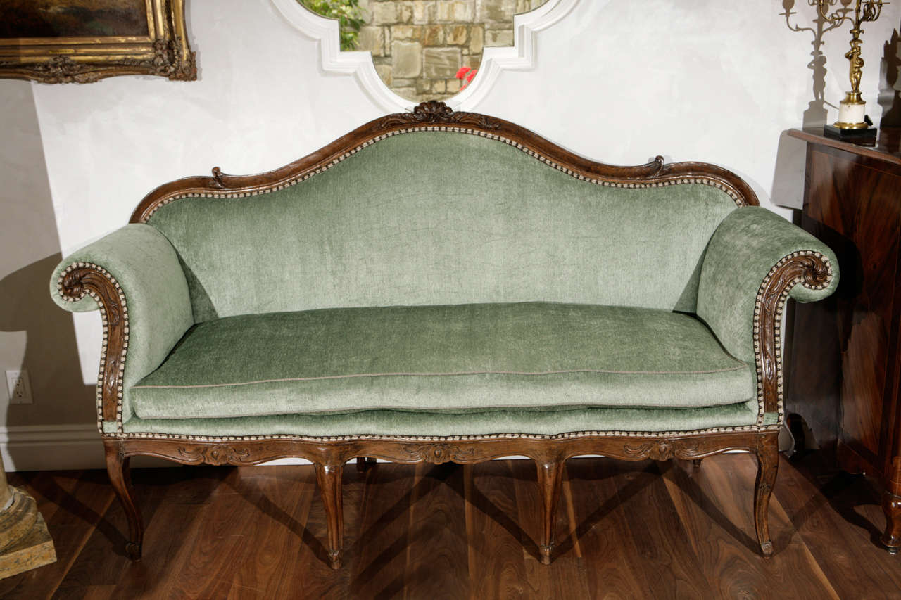 18th century Italian Walnut Single Cushion Settee newly upholstered in Celedon Green Decor de Paris Chenille Velvet.