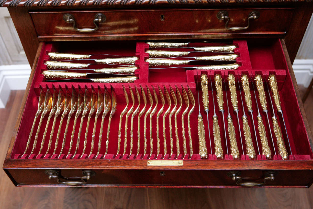 1900's English Flame Mahogany Ball and Claw Legged 4 Drawer Chest.  The Chest has been specifically fitted to house the included Vermiel Sterling Flatware.  The Flatware is Hallmarked 1900's C. P. Vanders, London.  There are 11 pieces per place