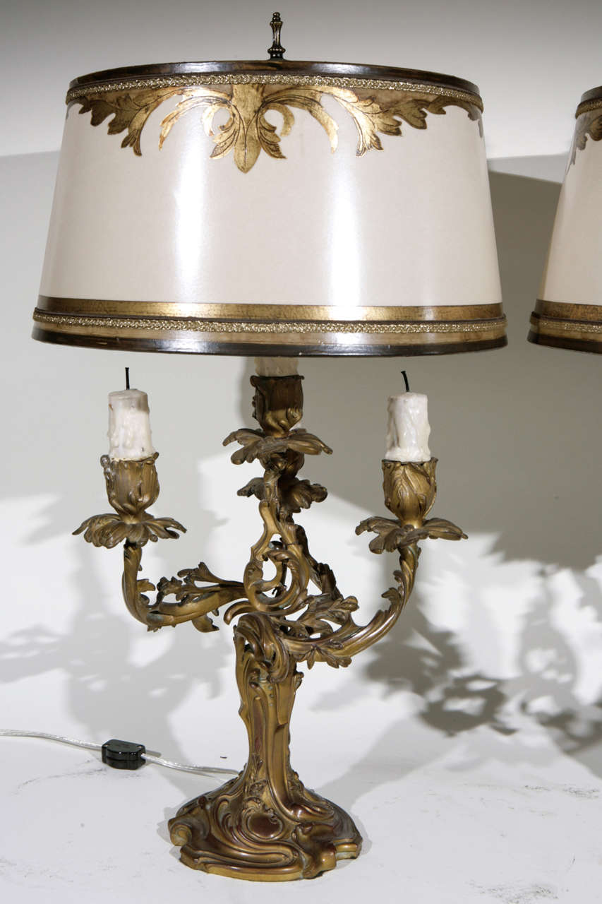 Pair of 19th c. French 3 Arm Dore Bronze Candelabras Converted to Lamps. The Shades are included and are Hand Made of Parchment Paper. They are Hand Gilded and Decorated. The lamps have been newly wired. The measurement to the top of the finial is