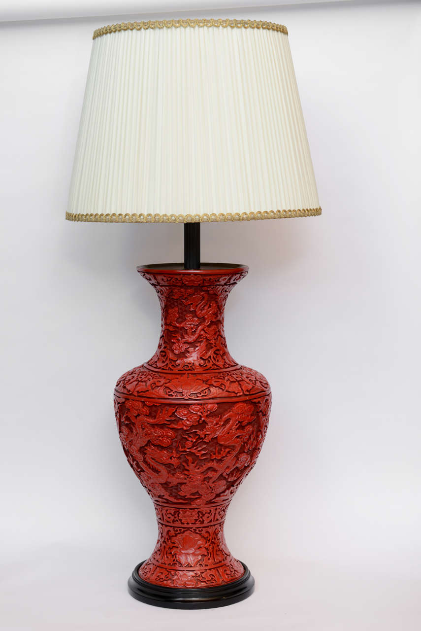 An impressive pair of red lacquered cinnabar vases mounted as lamps . Circa 19th century.