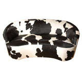 Vintage sofa upholstered in cowhide