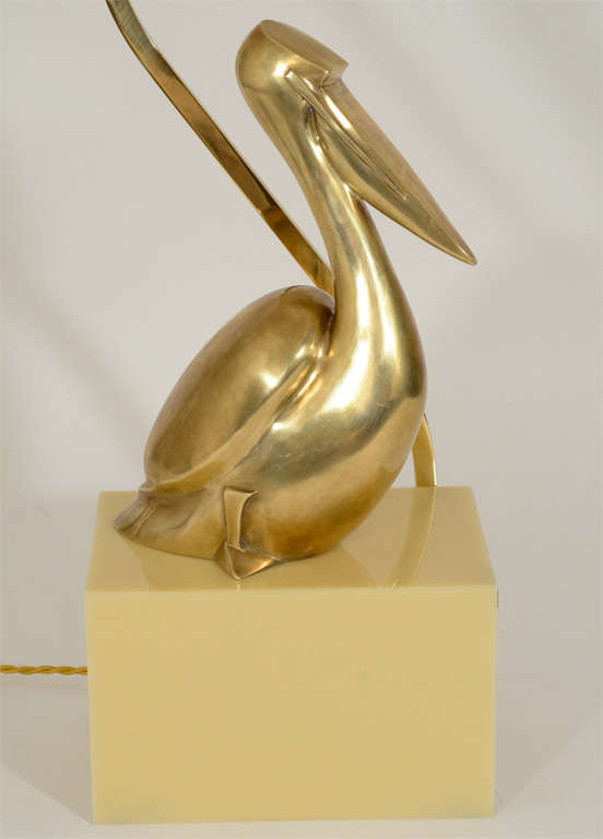 Brass Pelican Lamp on Cream-Colored Plastic Base 1