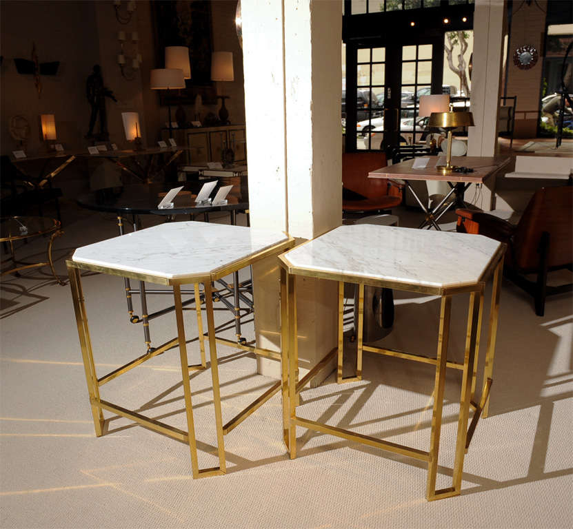 An elegant pair of square side tables with beautifully designed brass bases and inset Carrara white marble tops.
France - circa 1970